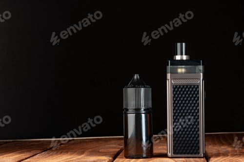 Preview: Vape and vape liquid bottles against black background