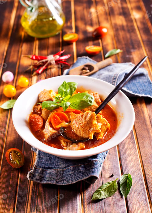 Preview: Homemade meat and vegetable stew or soup with tomato