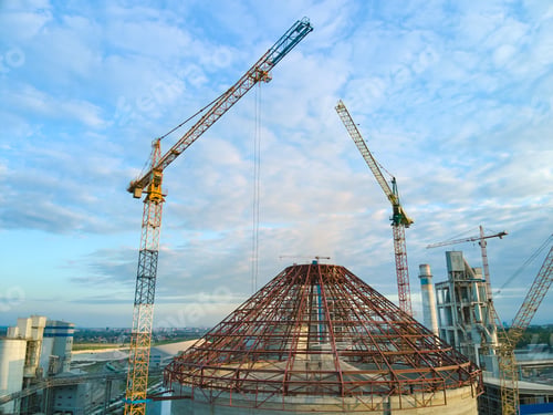 Preview: Aerial view of cement factory under construction with high concrete plant structure