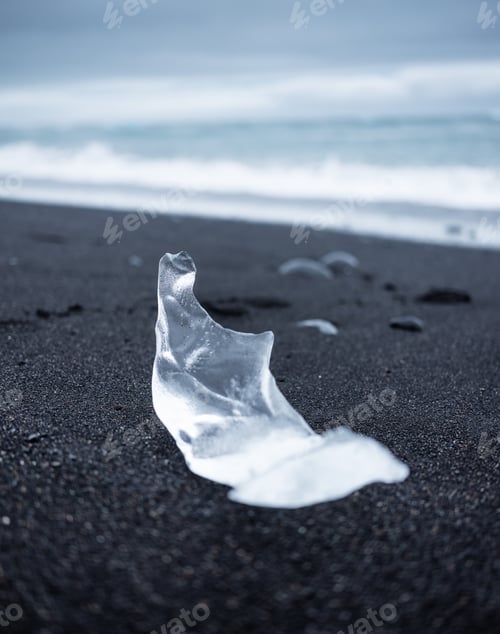 Preview: Ice on the black sand on the beach, Iceland. Ocean bay and icebergs.