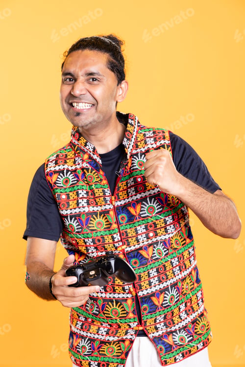 Preview: Ecstatic man feeling excited after being victorious in videogame using joypad