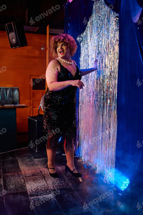 Preview: Bold drag queen captivates audience during vibrant holiday performance on stage