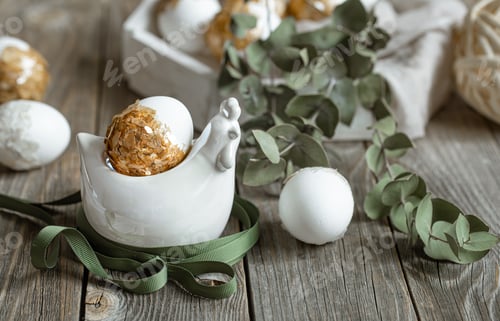 Preview: Spring easter composition with eggs and plants on wooden surface close up.