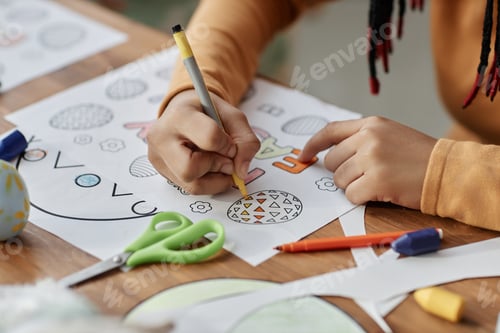Preview: Child Engaging in Drawing Activity with Colorful Designs