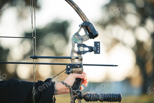 Preview: Archery bow closeup and woman hands at shooting range for competition, game or learning in field or