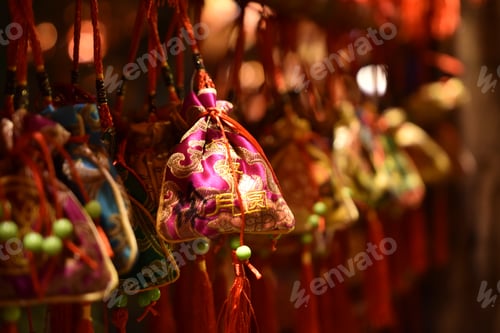 Preview: Selective-focus shot of a traditional asian purse in bokeh lights