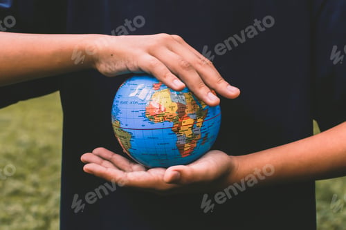 Preview: Hand holding globe for Earth Day Campaign