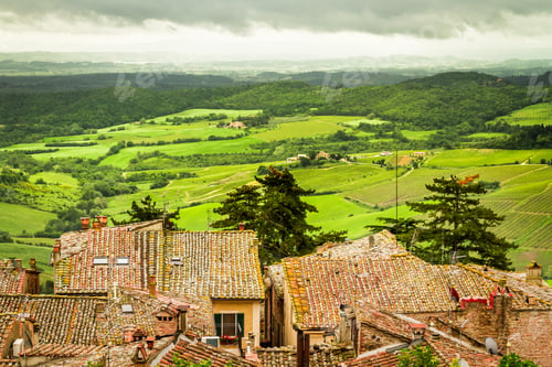 Preview: View of the red roofs and green valley in Volterra, Italy