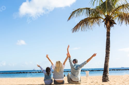 Preview: beautiful family on a tropical beach with palm tree during summer vacation