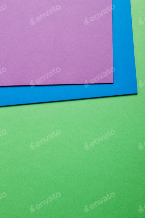 Preview: Colored cardboards background in green blue purple tone. Copy space. Horizontal