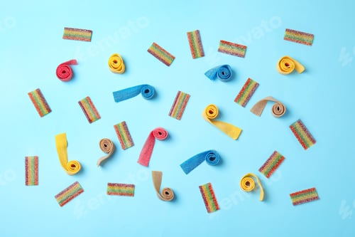 Preview: Flat lay composition with different yummy candies on color background