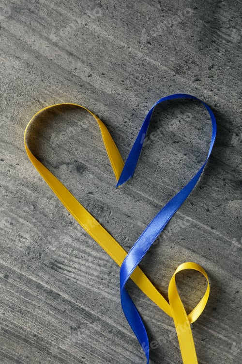 Preview: Heart made of ribbons in Ukrainian flag colors on gray wooden background