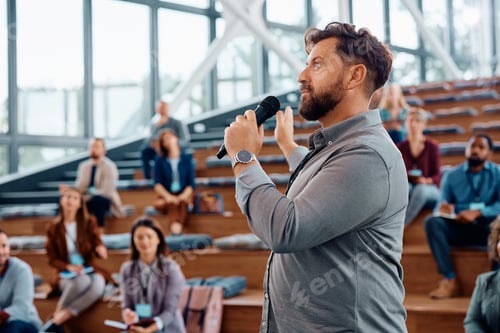 Preview: Entrepreneur giving a speech during business seminar at conference hall.