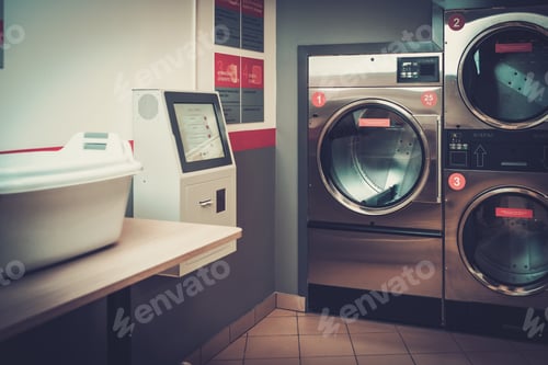 Preview: Laundry machines at laundromat shop.