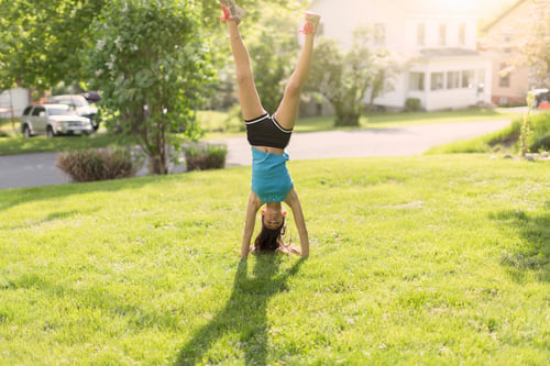 Preview: Teenage girl doing headstand