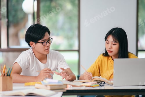 Preview: An asian students are reading books and study, Tutoring together.