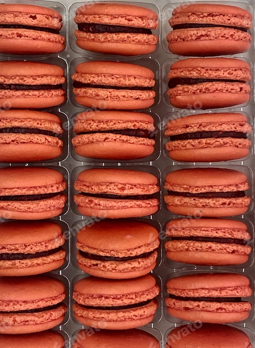 Preview: Sweet Strawberry Macrons stacked vertically in a local patisserie