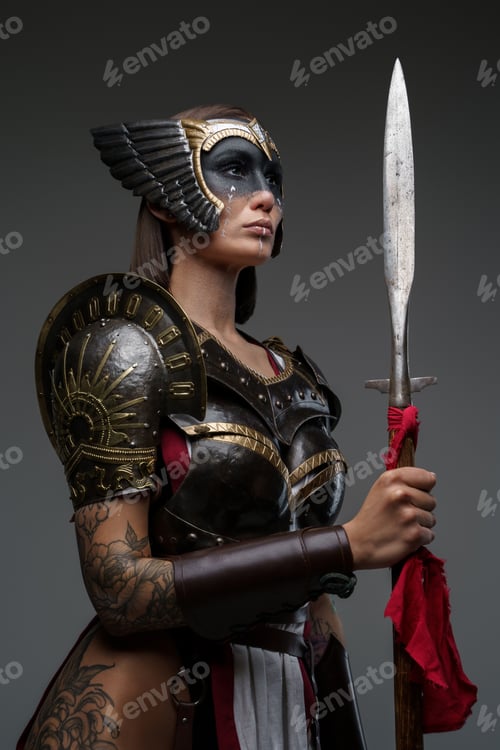 Preview: Wild amazon dressed in dark armor holding spear
