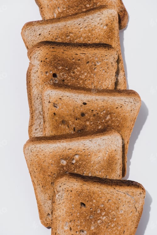 Preview: top view of stack of crunchy toasts on white tabletop
