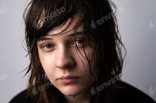 Preview: Closeup of a Young teen girl crying isolated on a white background - people and moods concept