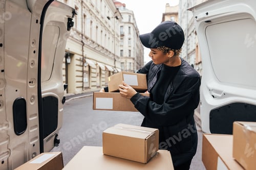 Preview: Courier preparing parcels for delivery.