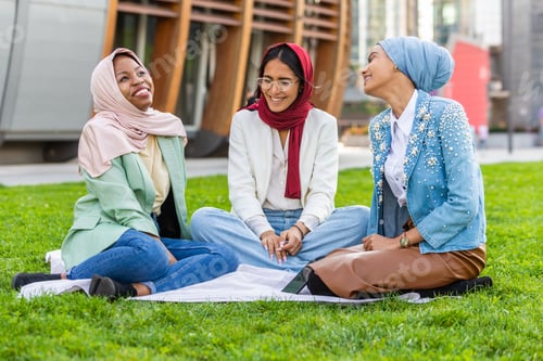 Preview: Beautiful muslim girl wearing hijab bonding outdoors