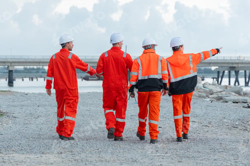 Preview: Engineering Team Walking Along Coastal Worksite