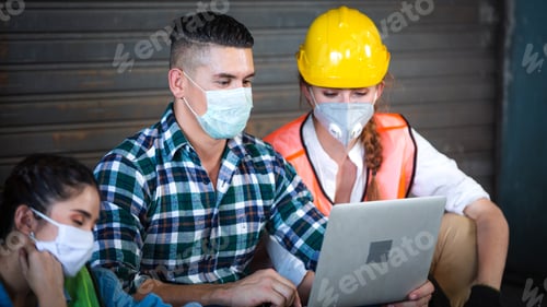 Preview: Construction worker watching project on laptop together or searching for new job