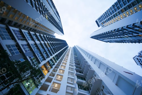 Preview: low angle view of signapore residential buildings against blue sky