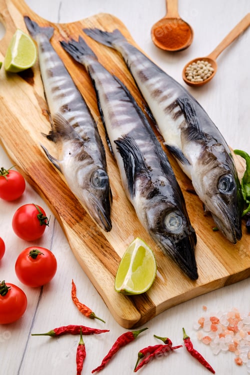 Preview: Fresh icefish on wooden cutting board