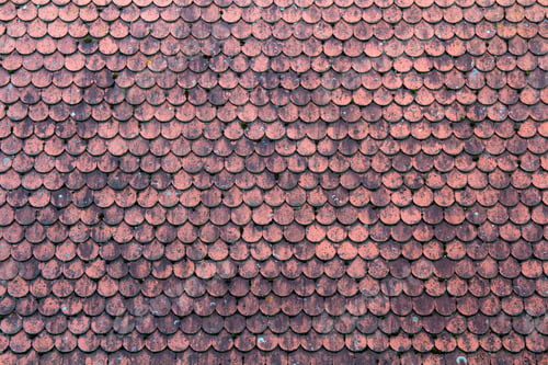 Preview: Old roof covered with red tiles for usage as background
