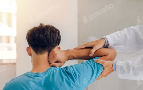 Preview: Doctors or physical therapists work to treat the injured arm of a male patient who has performed