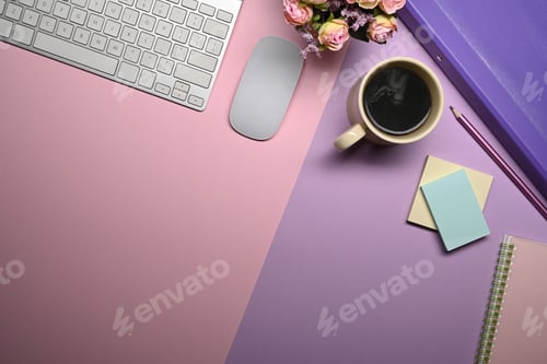 Preview: Above view wireless keyboard, coffee cup and supplies on purple background.