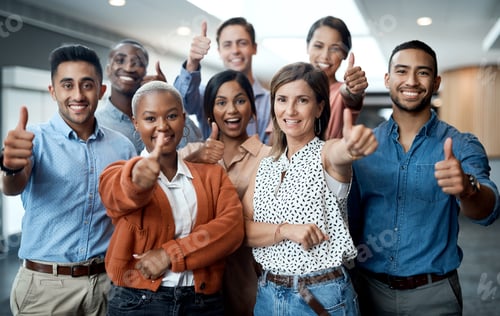 Preview: Portrait of a group of young businesspeople showing thumbs up in a modern office