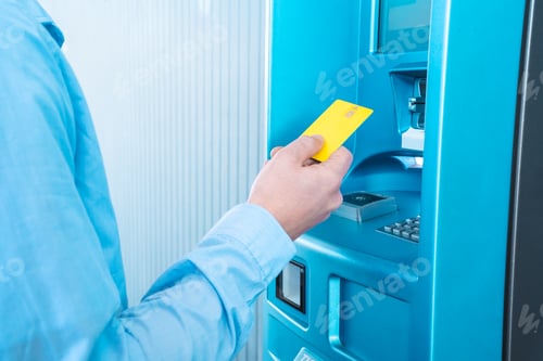 Preview: A man is inserting a blue plastic card into the machine