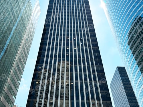 Preview: View From Below To Tops Of Glass Modern Architecture Buildings on Blue Sky Background