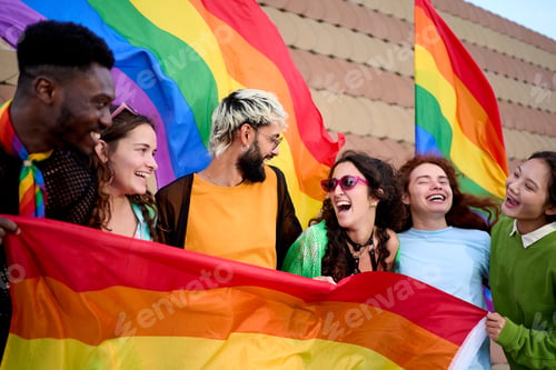 Preview: Group of excited young friends enjoying together on gay pride day. Joyful people gathered lgbti.