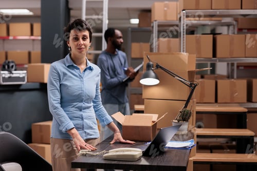 Preview: Portrait of supervisor working in storehouse delivery department checking shipping details