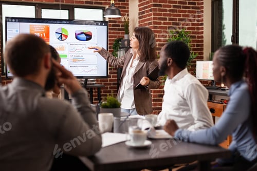 Preview: Entrepreneur woman standing in front on monitor explaining marketing strategy
