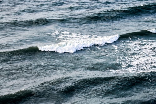 Preview: Deep blue sea waters splashing with foamy waves, dark blue wavy ocean water surface, stormy sea