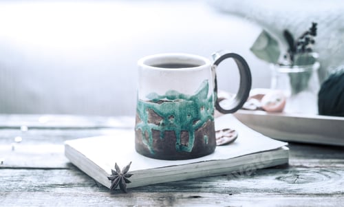 Preview: book and a cup of tea on a wooden background