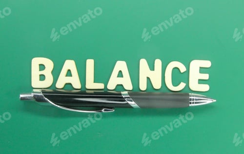 Preview: pen with the word balanced. concept of balance