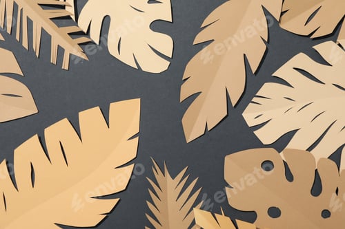 Preview: Paper beige tropical leaves on a dark, gray background.