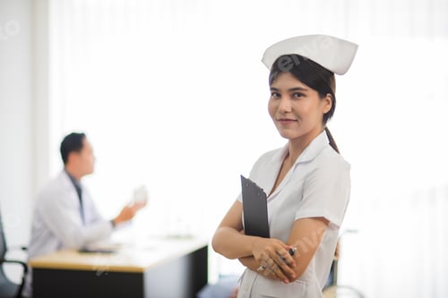 Preview: Asian nurse woman standing with smile and happiness with patient and doctor in background.