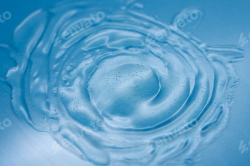 Preview: Abstract texture. Liquid gel cosmetics. Blue background.