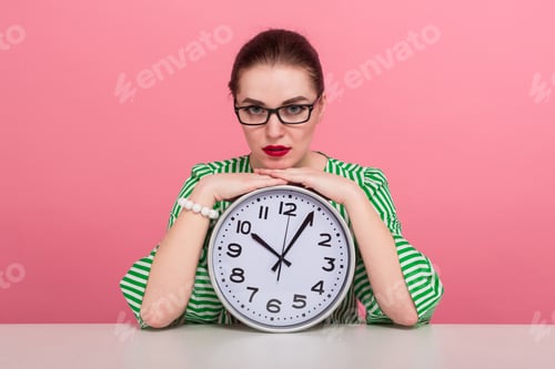 Preview: Businesswoman with hair bun and clocks