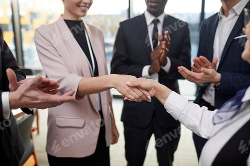 Preview: Business people congratulating their colleague