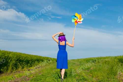 Preview: young woman with wind toy