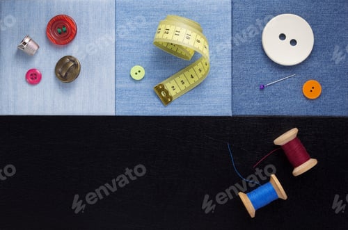 Preview: sewing tools and accessories on jeans background