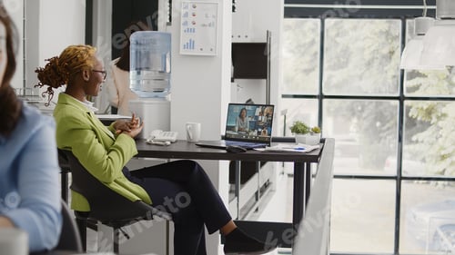 Preview: Young employee attending briefing meeting video call